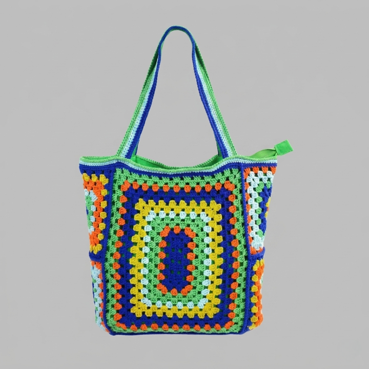 Blue Green crocheted bag with a geometric pattern on a gray background
