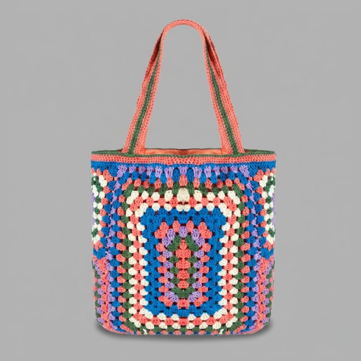 Pink Purple crocheted bag with a geometric pattern on a gray background