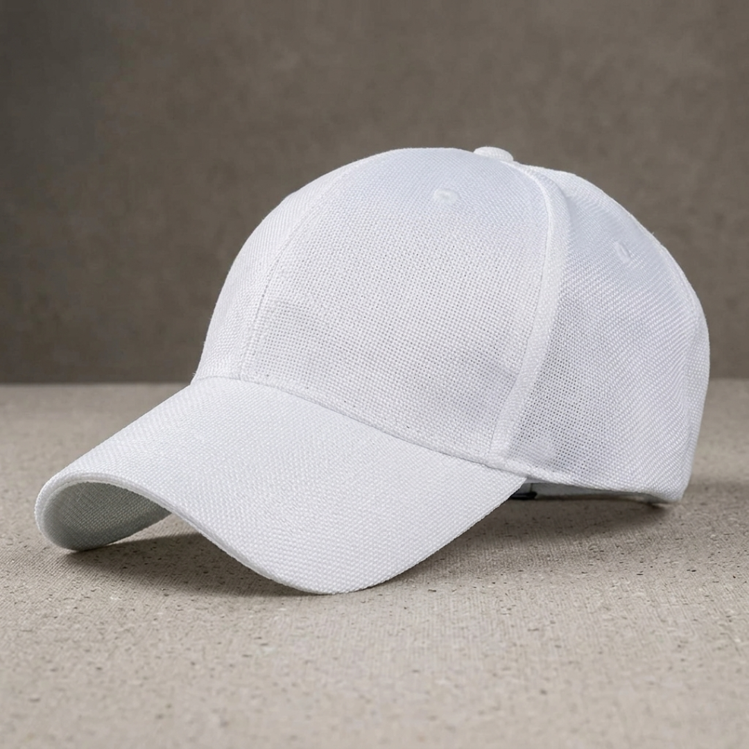 White baseball cap on a beige surface with a neutral background