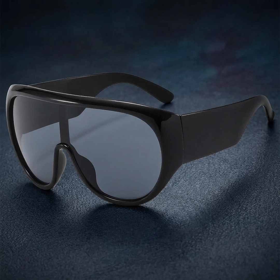 Black sunglasses with a reflective surface on a dark background