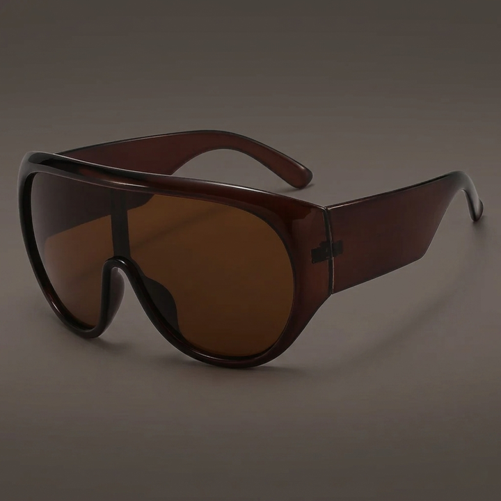 Tea sunglasses with a reflective surface on a dark background