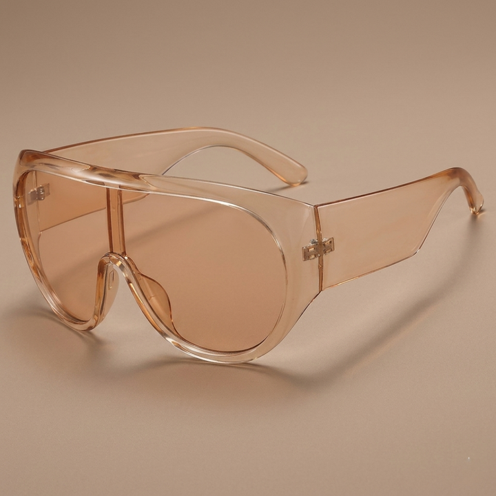 Champagne Light Tea sunglasses with a brand logo on a beige background