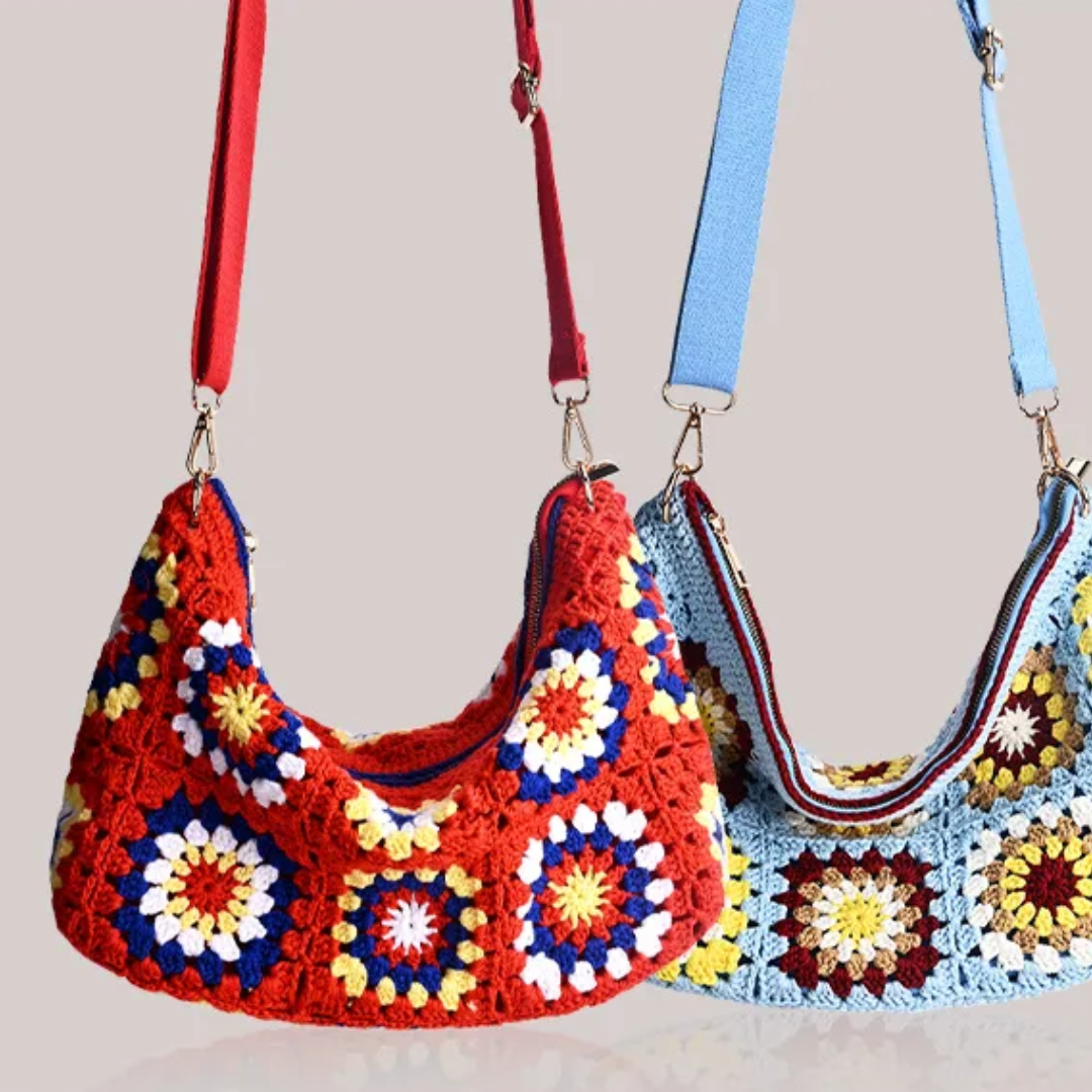 Two colorful crochet handbags with floral patterns on a neutral background