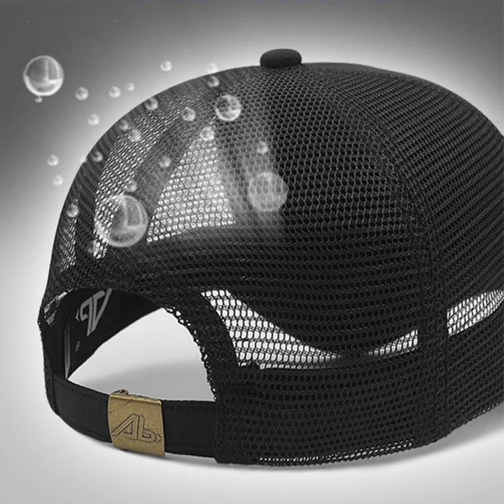 Black mesh cap with a gold logo on a gray background
