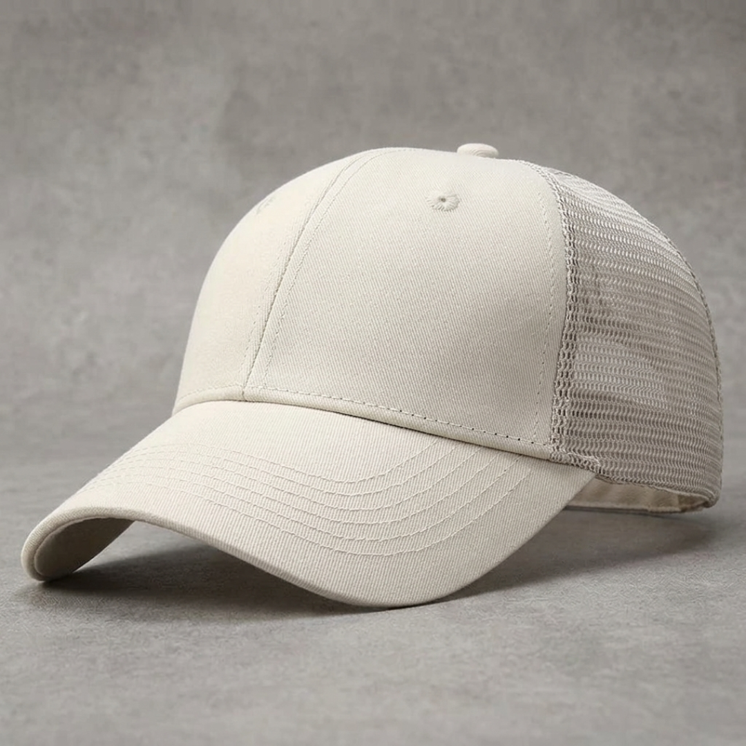 White baseball cap with mesh back on a gray background