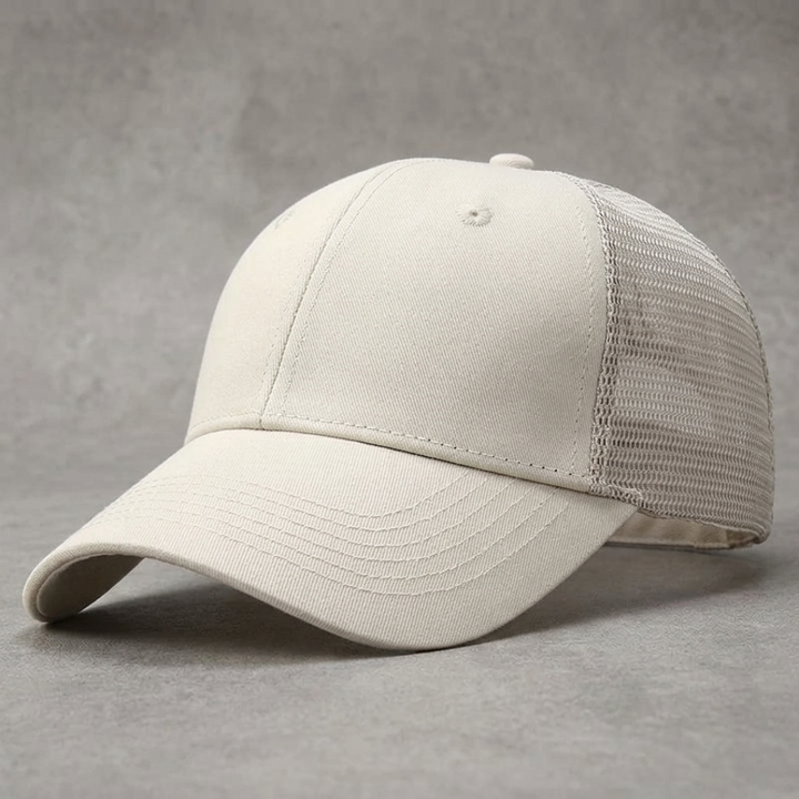 White baseball cap with mesh back on a gray background