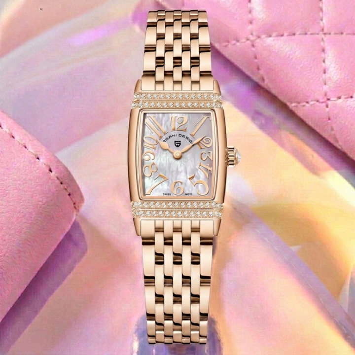 Gold watch with a pink and purple gradient background