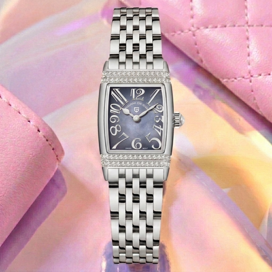 Silver watch with a purple face on a pink and purple gradient background