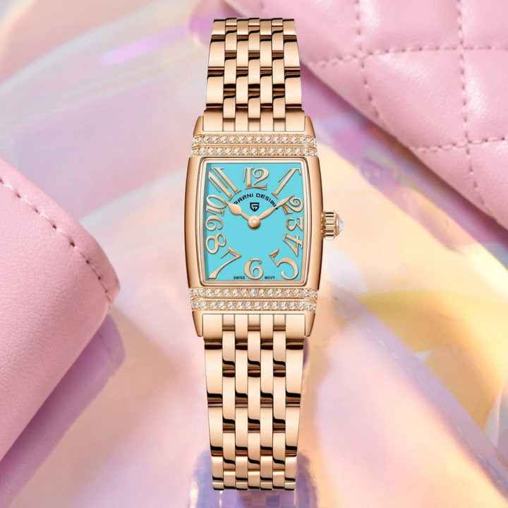 Gold watch with a blue face on a pink and yellow gradient background