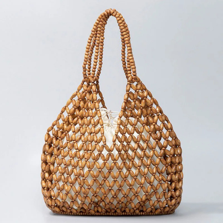 Brown wooden beaded handbag on a light gray background