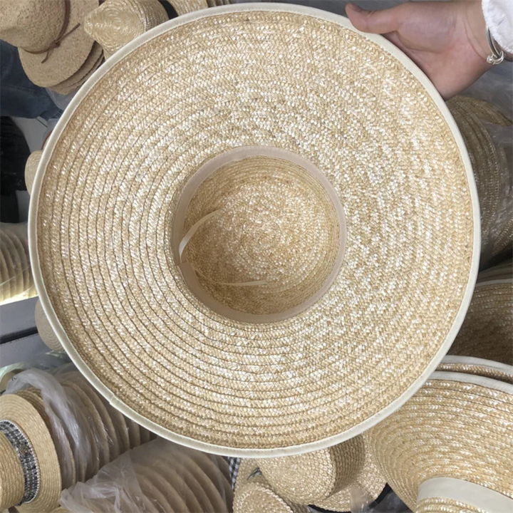 Close-up of a straw hat with a blurred background of similar hats.