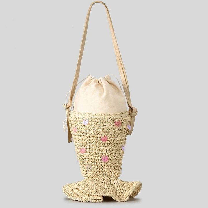 Woven bag with a drawstring top and mermaid tail design on a gray background