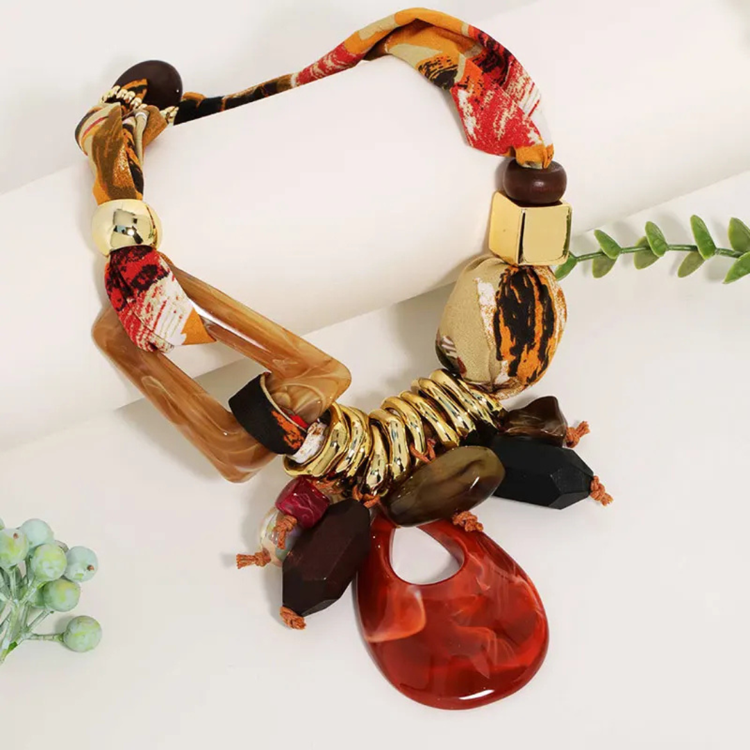 Orange Statement Necklace place in a flat surface