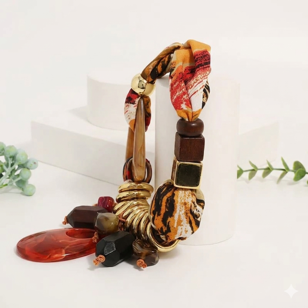 Orange Statement Necklace place in a flat surface with a neutral background
