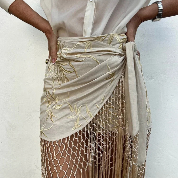 Apricot embroidered skirt with a white background